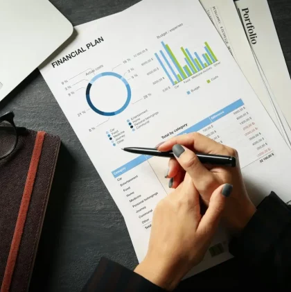 business-woman-doing-financial-planning-on-black-table-with-documents.jpg